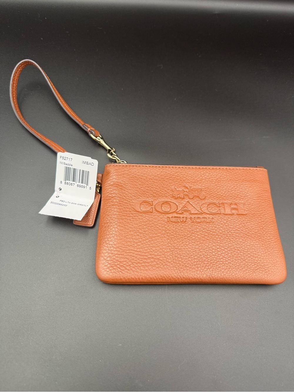 COACH Pebbled Leather Wristlet in Saddle